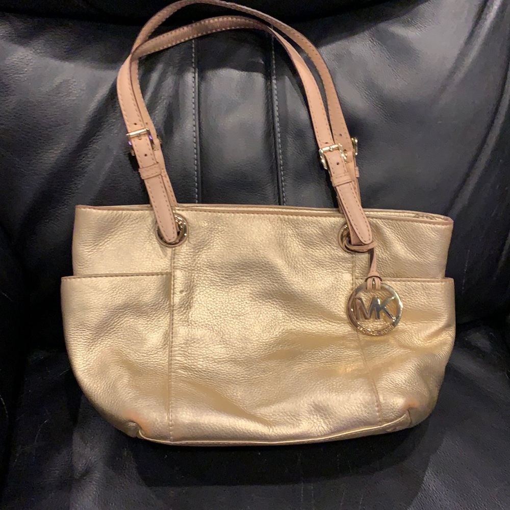 Gold Michael Kors purse.